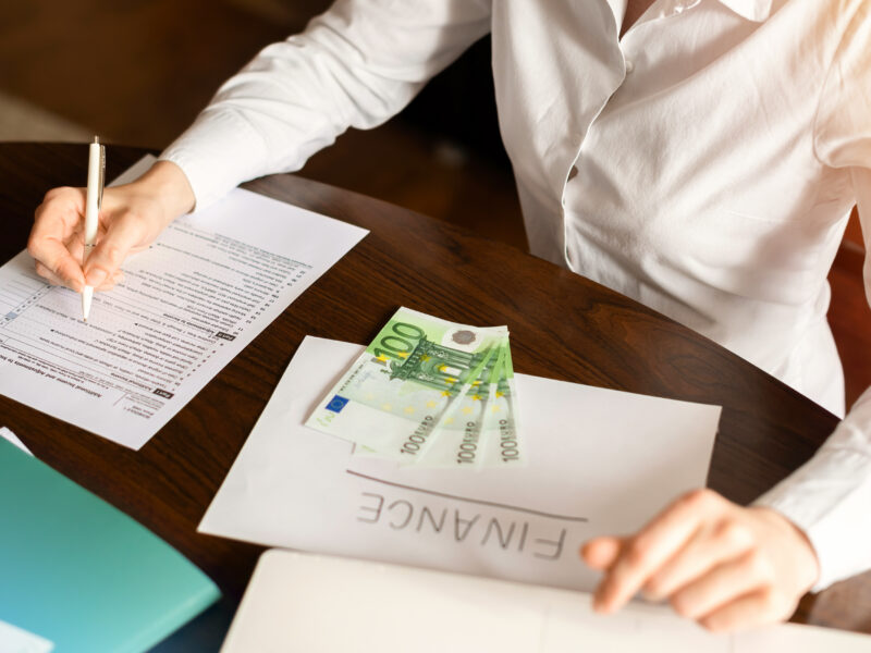 woman working with finances table money papers